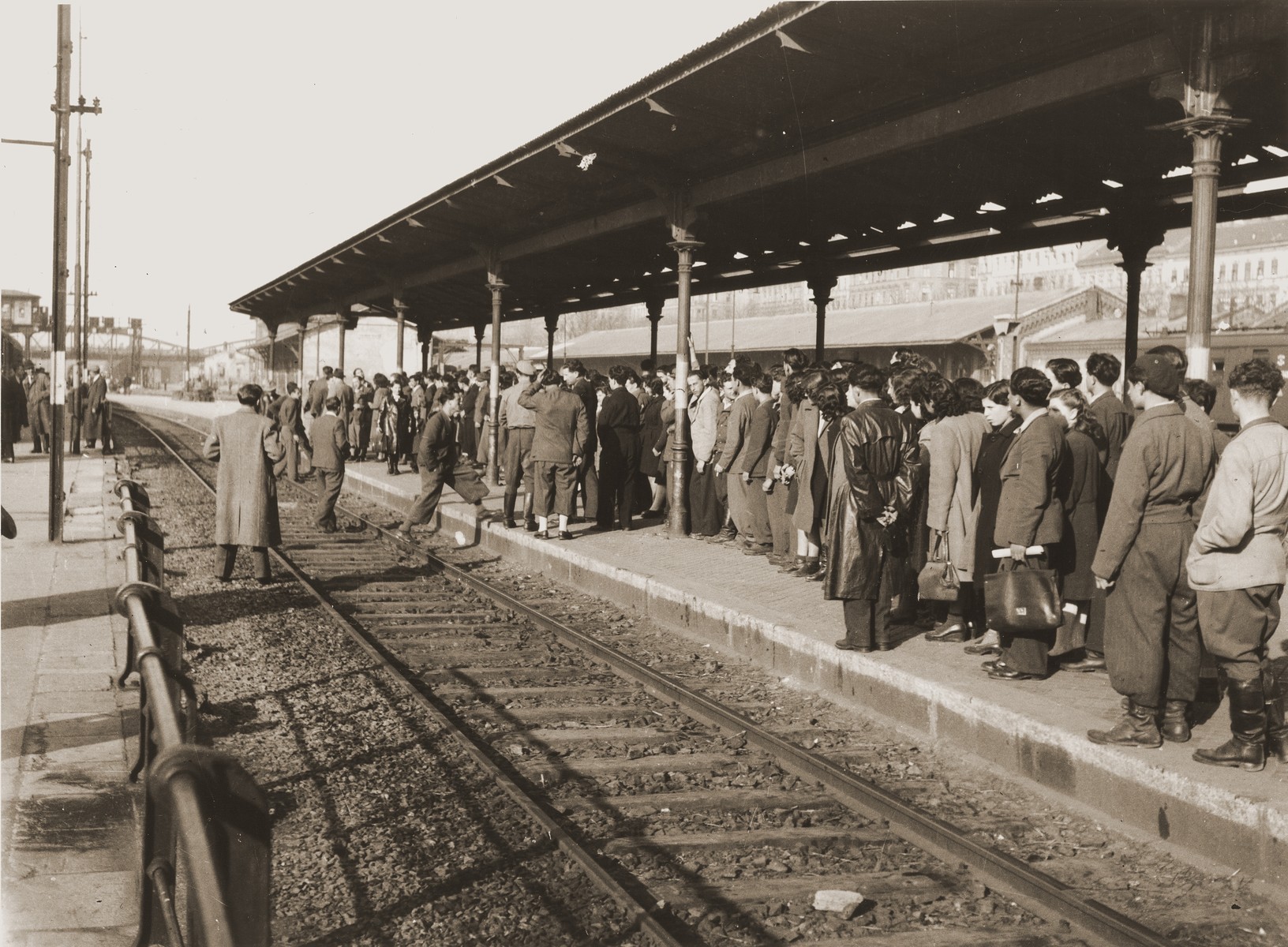 A group of Jewish DPs waits at the Vienna railroad station for a train to take them on the next leg of their journey along the Bricha route to the American Zone of Germany.