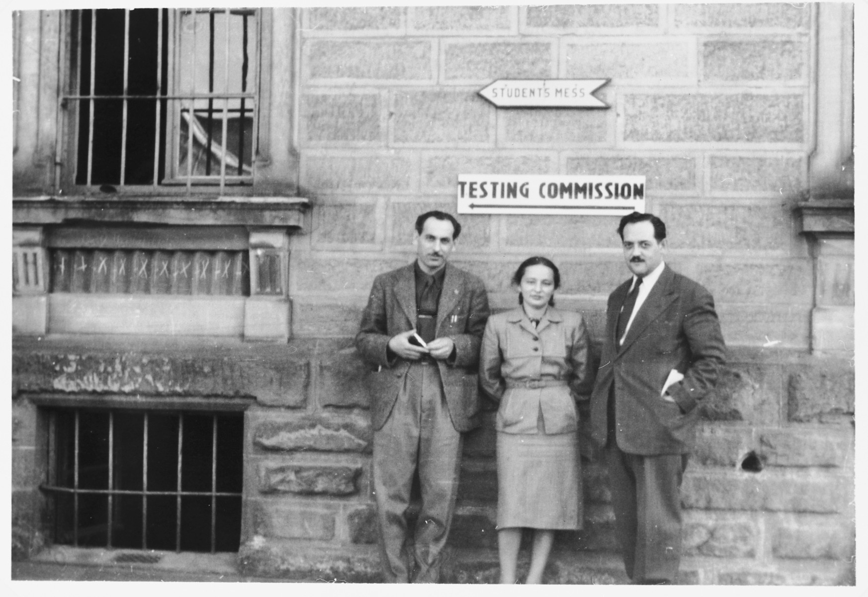 Canadian delegates stand outside the testing commission where prospective immigrants into Canada will be trade tested.

From left to right are David Siegel, the liaison between Canadian immigration and the Canadian Jewish Congress, Bella Meiskin of the Jewish Labor Committee and Lucien St. Cyr from the Canadian Labor Department.