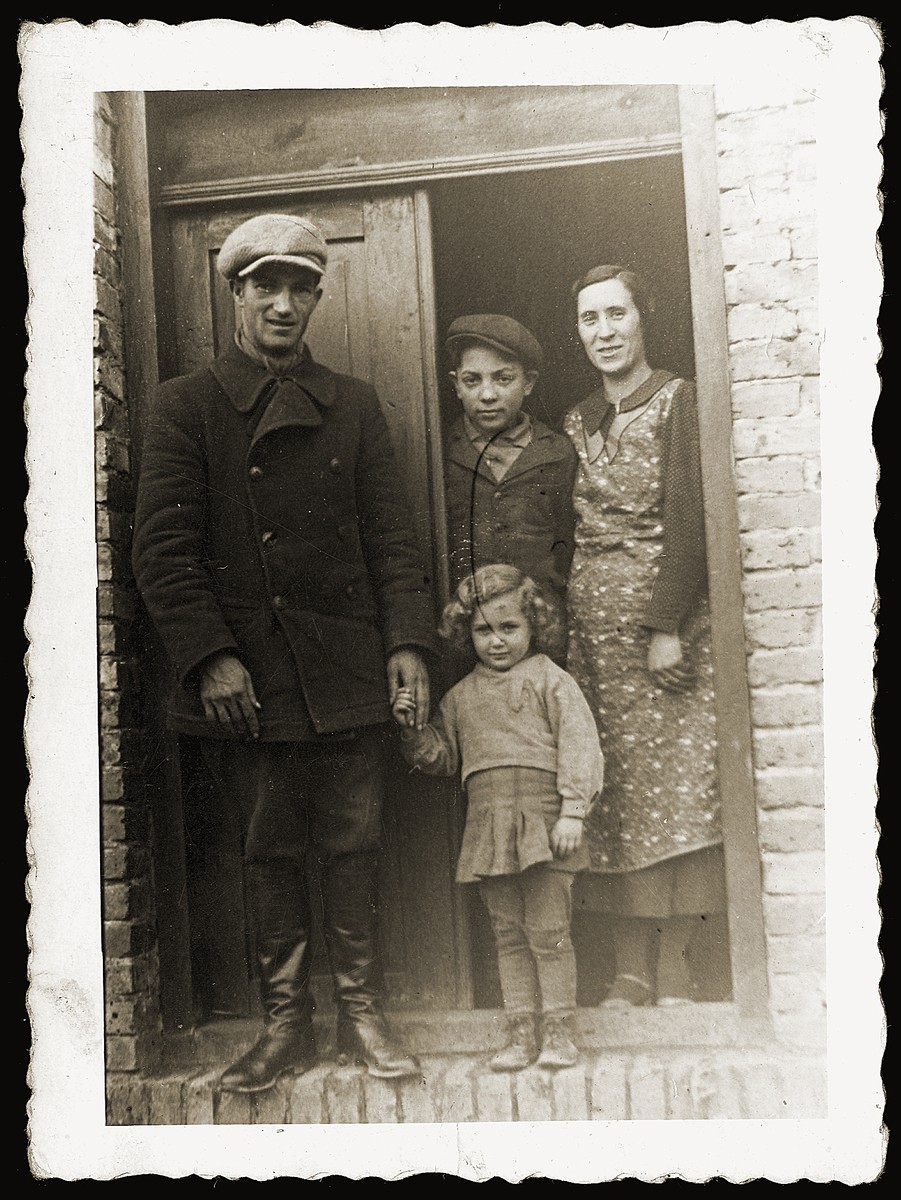 Zendel Lancman, his wife and children stand in the doorway of their home.