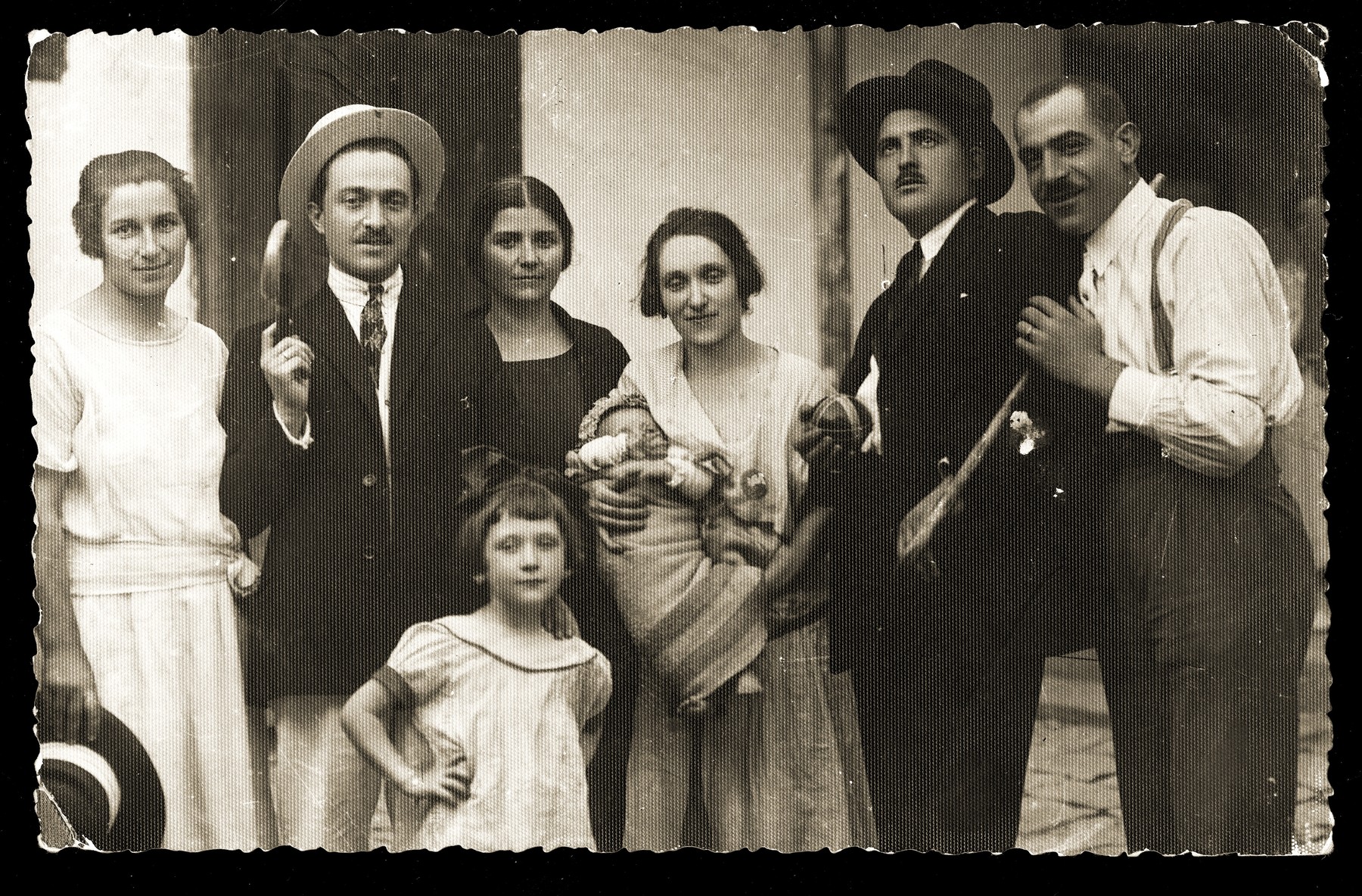 Group portrait of the Konfino family in Belgrade.  

Among those pictured are Gavra (far right), Gabriela (Ela, the child in front), and Gizela (the infant).