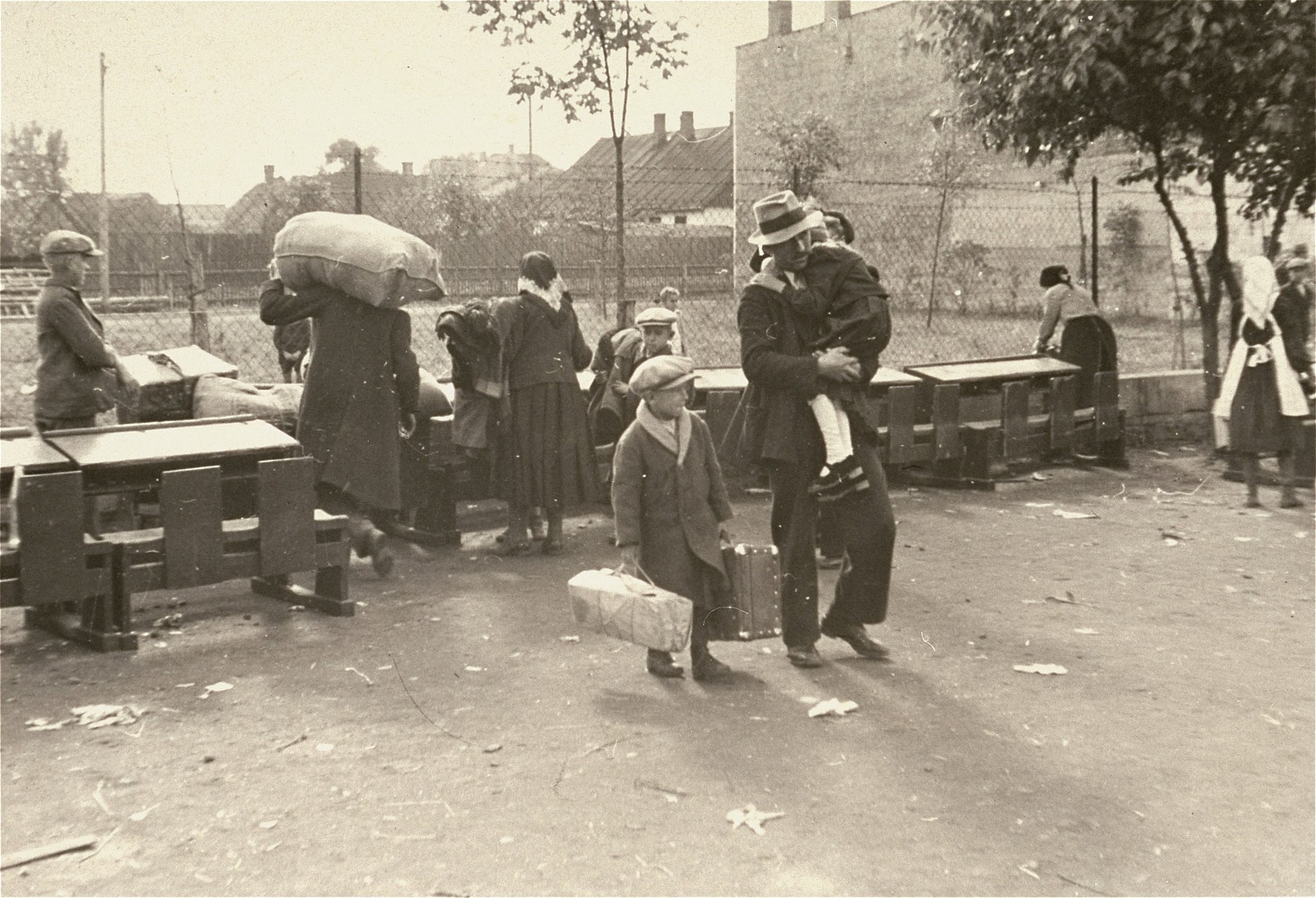 [Probably, Poles waiting at an assembly point during a resettlement action.] 

One image of Einsatzgruppen activities in Poland in 1939, found by Joseph Igra after the war, in a an album in an apartment in Sosnowiec.