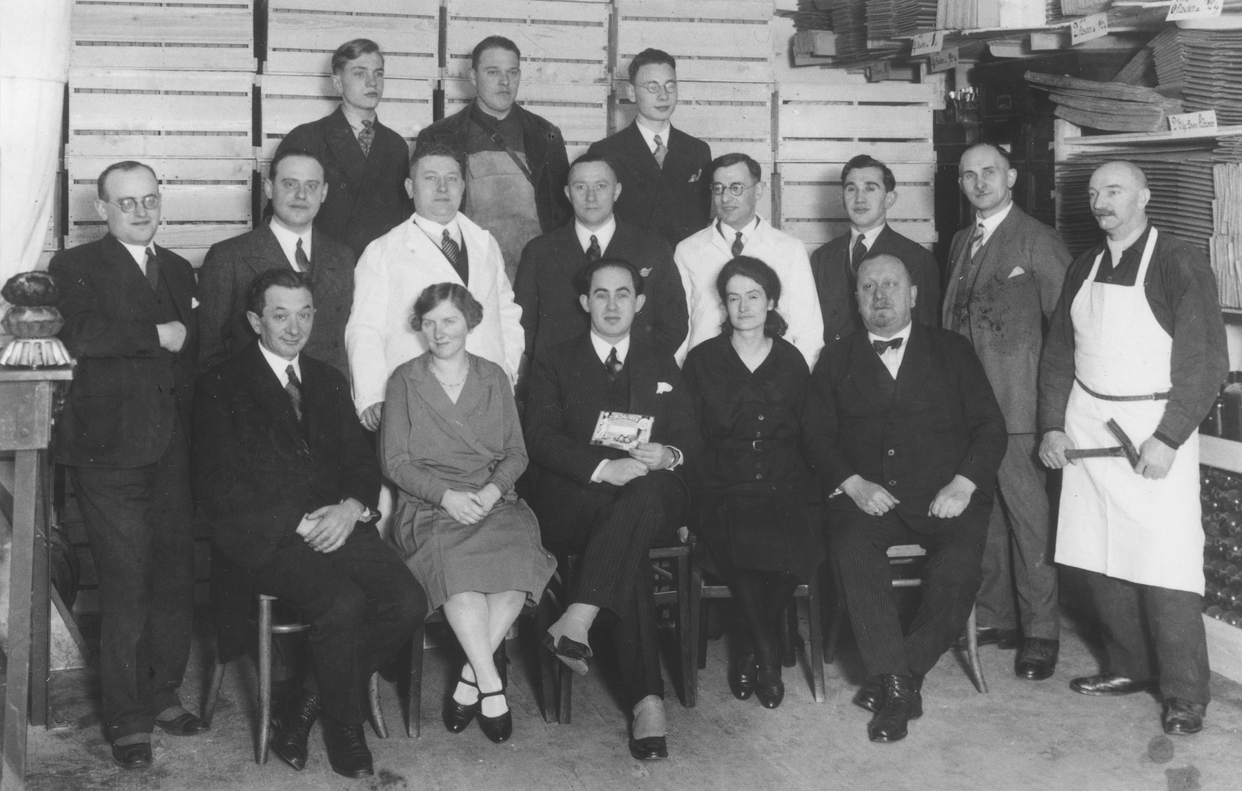 Group portrait of the employees of a business where Cecil Gelbart worked as a chemist.

Cecil Gelbart is standing in the middle row, fourth from the right.