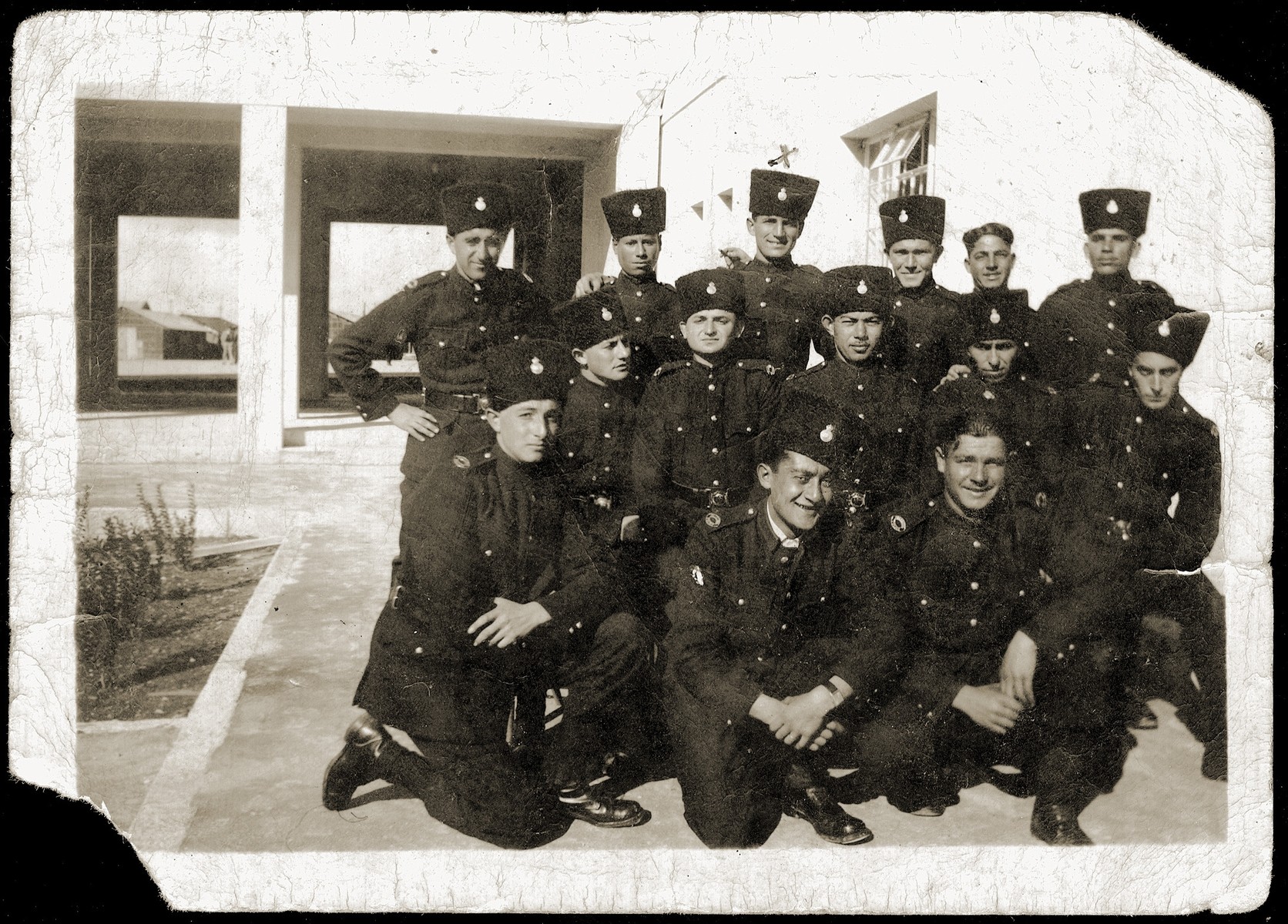 Group portrait of members of the British mandate police force in Haifa.  

Among those pictured is Mordechai Schwarcz.