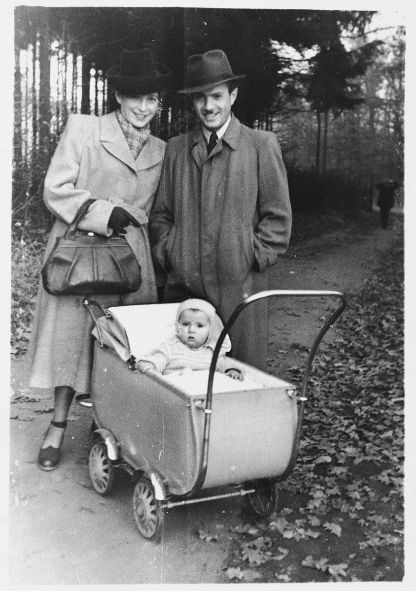 A Jewish couple take their baby daughter for a walk in the Ansbach displaced persons camp.

Pictured are Moniek and Sara Kleinhandler and their daughter, Varda.