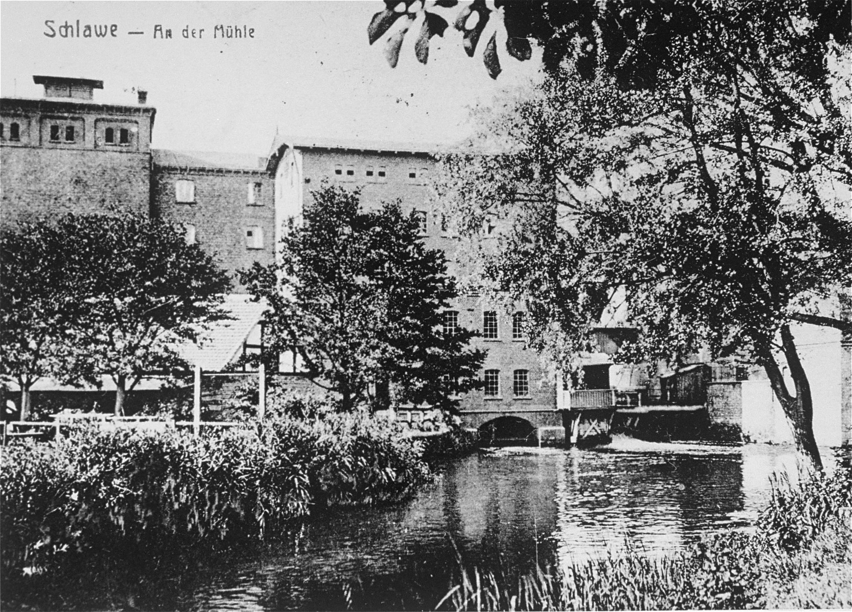 View of the Schlawer Muhlenwerke, a mill owned and operated by Hugo Gottschalk.  

The mill was founded in 1872 by Benjamin Gottschalk (1834-1902).  His son, Hugo, took over the mill after his death.  The mill remained in the hands of the Gottschalk family until 1923, when it was sold to the city of Schlawe.