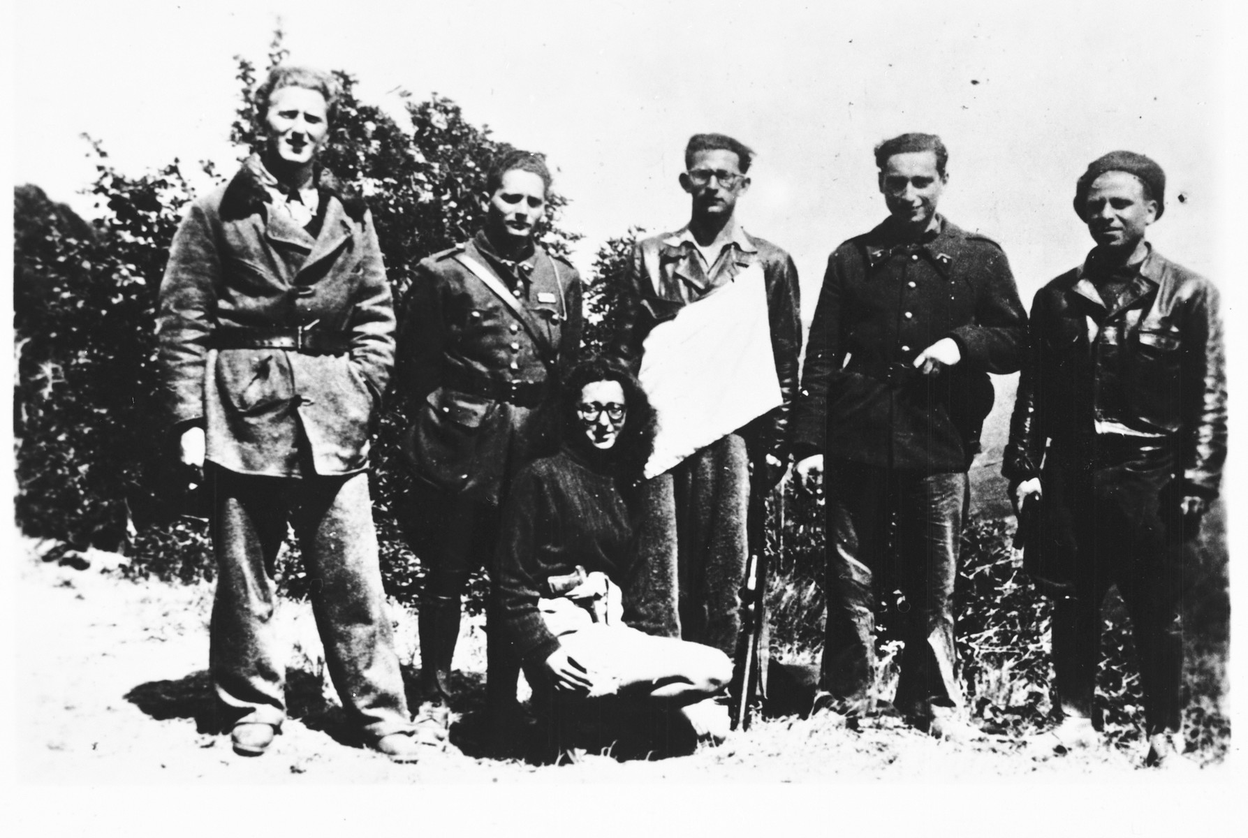 Group portrait of members of the French Jewish resistance group Armée Juive dressed in military uniform.

During the last year of the war, the Armée Juive joined forces with the Maquis resistance.  Among those pictured are Patricia Graff-Rubel (kneeling), and standing from left to right: Jean-Jacques Fraicent (Frayman), Jacques Lazarus (Jacquel) who served as the AJ's military instructor, Henri Broder, Pierre Loeb and Albert Cohen (Bebe).