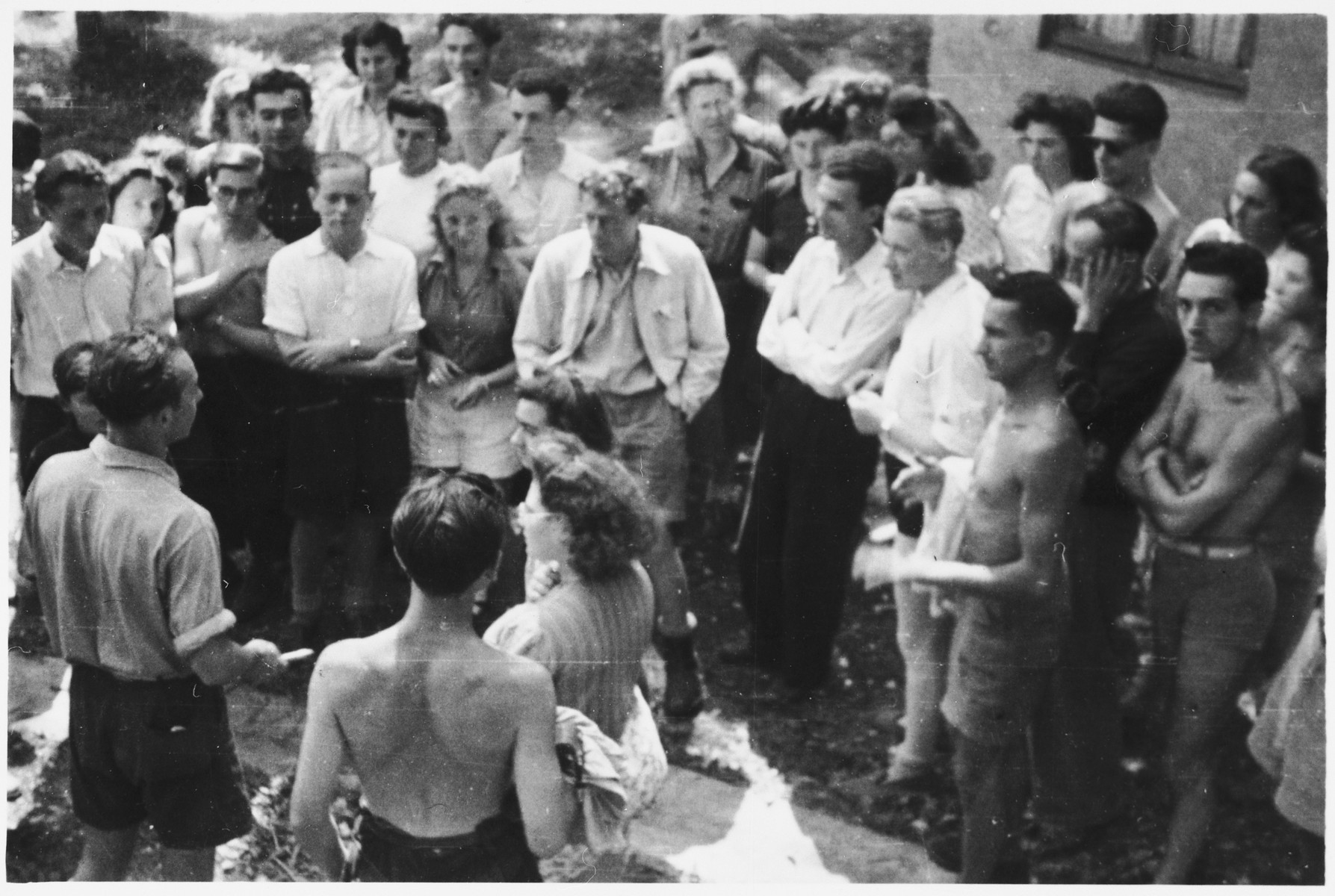 Otto Giniewski (Toto) addresses members of the French Jewish resistance group MJS (Zionist Youth Movement).

Among those pictured are Paul Giniewski, Joseph Fuks, Maurice Hausner, Tony Green, Georges Schneck, Jeanne Latchiver, Harry (Tzvi) Stein, Charlotte (last name unknown) and Michel Latchiver.