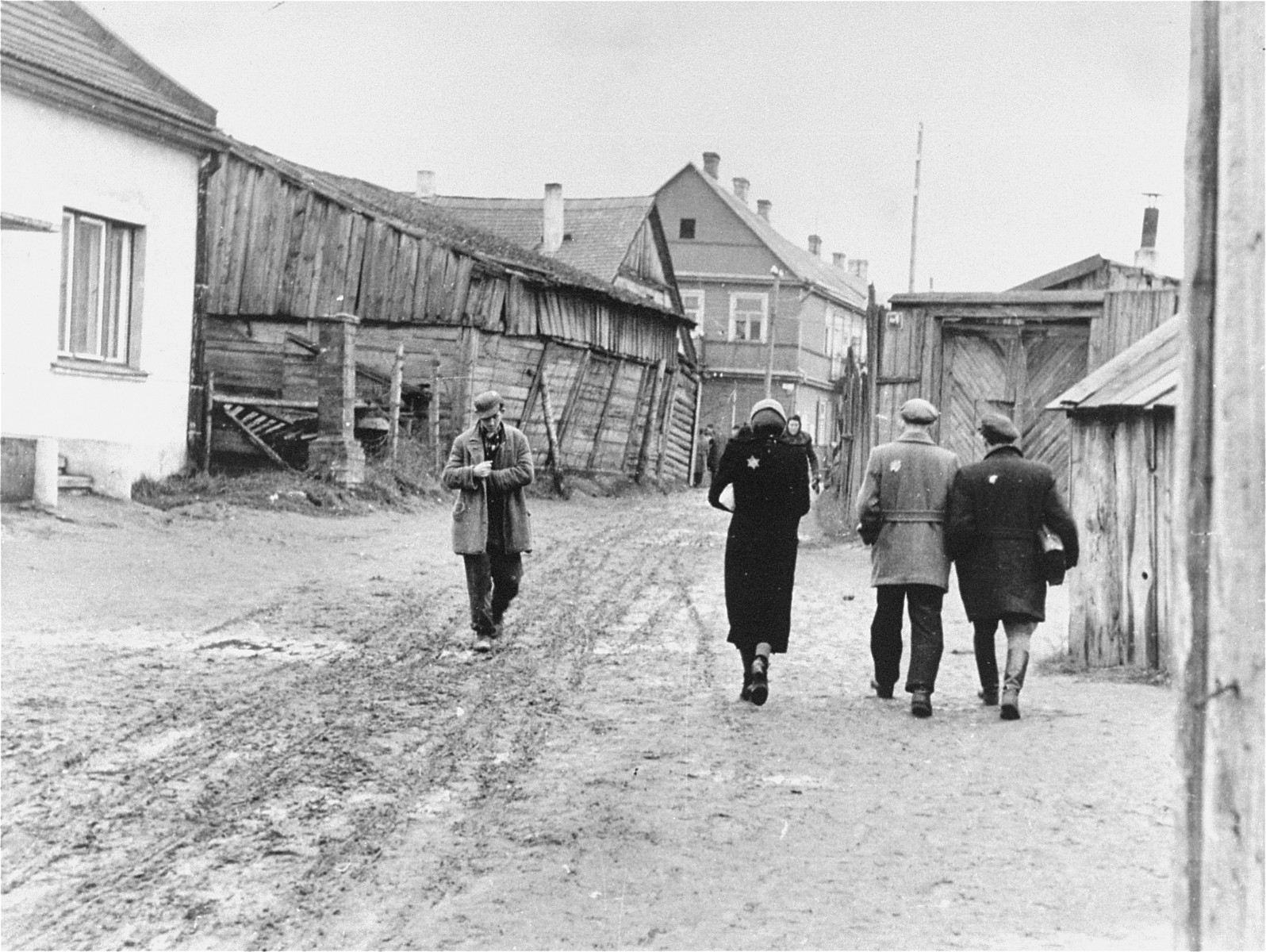 Street scene in the Kovno ghetto.  

Pictured first on the right is Chaim Yellin. To his left is his friend, Pesach Shater.