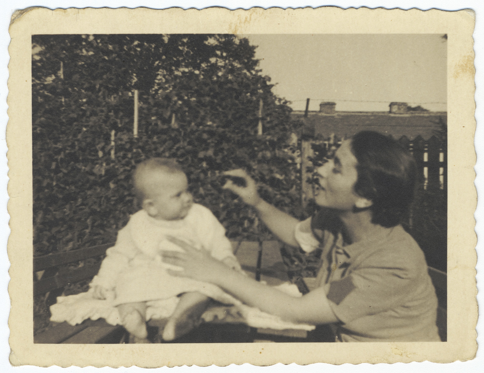 A Jewish mother plays with her newborn child in the year following the German invasion of Poland but prior to the establishment of a ghetto in Krakow.

Pictured are Regina and Stefania Hoffman.