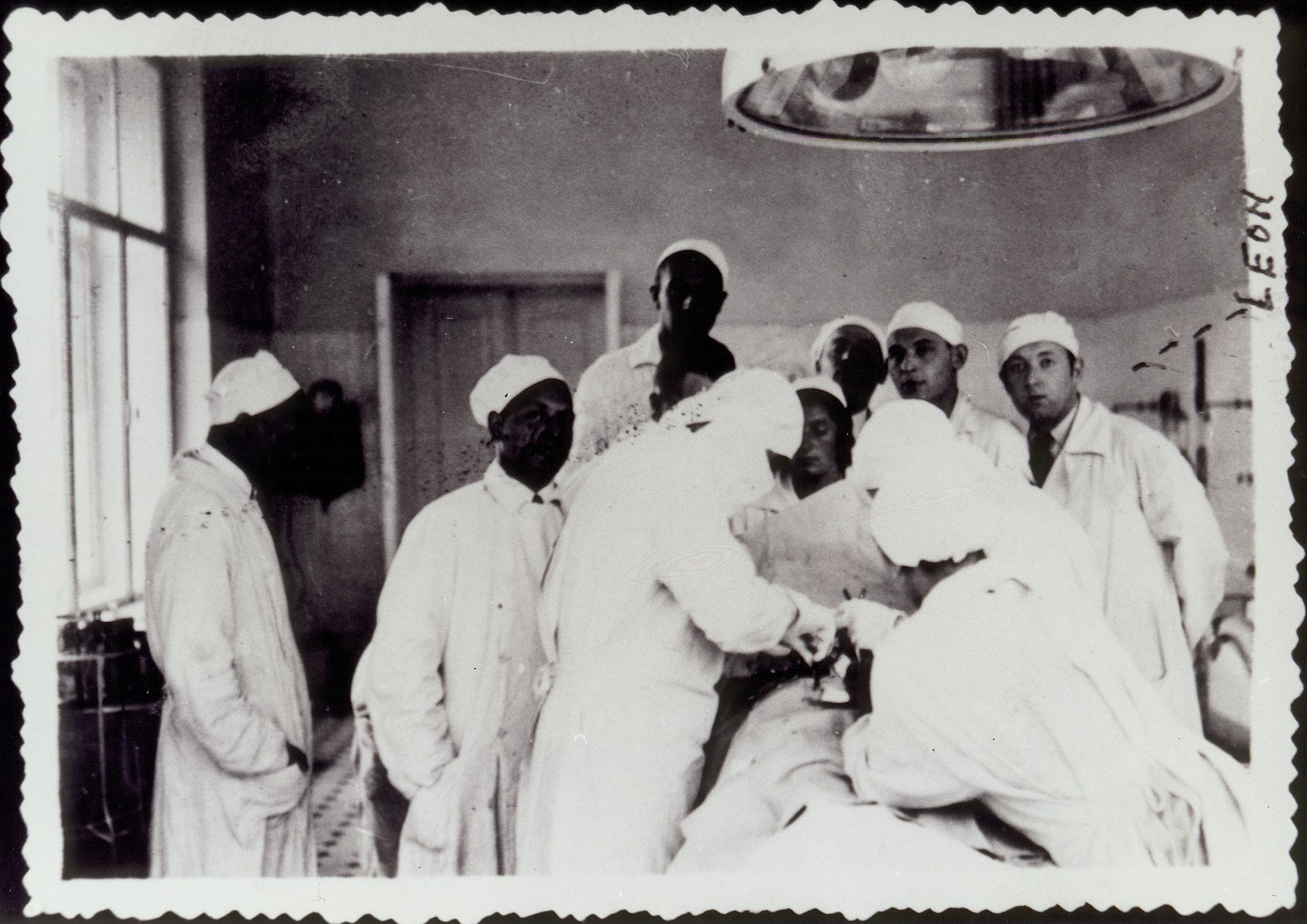 Dr. Leon Gordon and other physicians perform surgery in the hospital in Vilna.