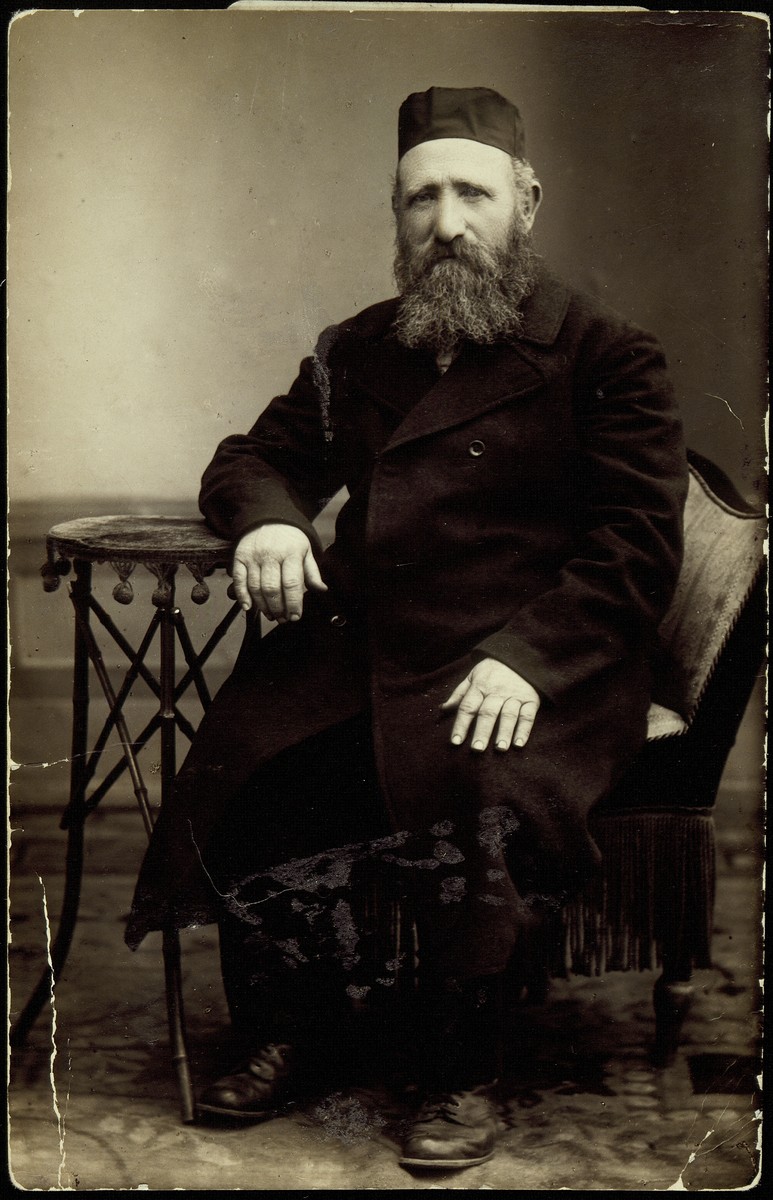 Studio portrait of Jewish businessman Reb Reuven Kaganov.

Reb Reuven Kaganov worked in the flour business in Eisiskes and was known by his Polish nickname "bialy zyd" (white Jew).  He died a natural death prior to the German occupation of Eisiskes.