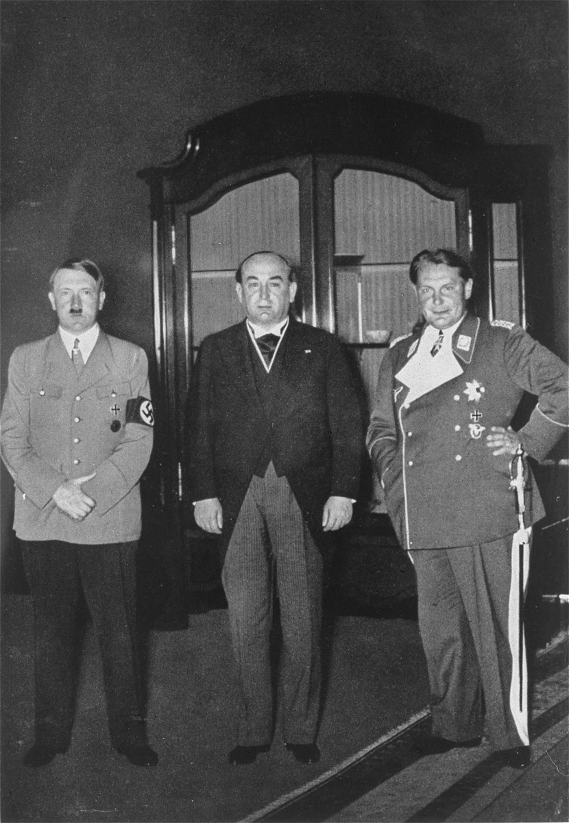 Hungarian President Gyula Gombos (center), on an official visit to Berlin, poses for a photograph with Adolf Hitler and Hermann Goering (right).