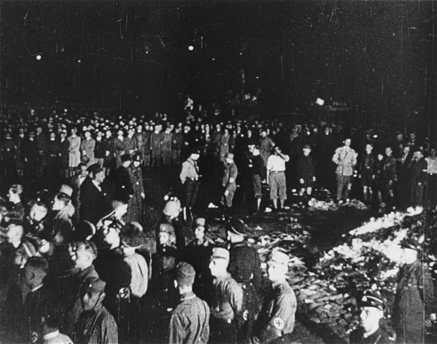 The public burning of "un-German" books by members of the SA and university students on the Opernplatz in Berlin. 

Still from a motion picture.