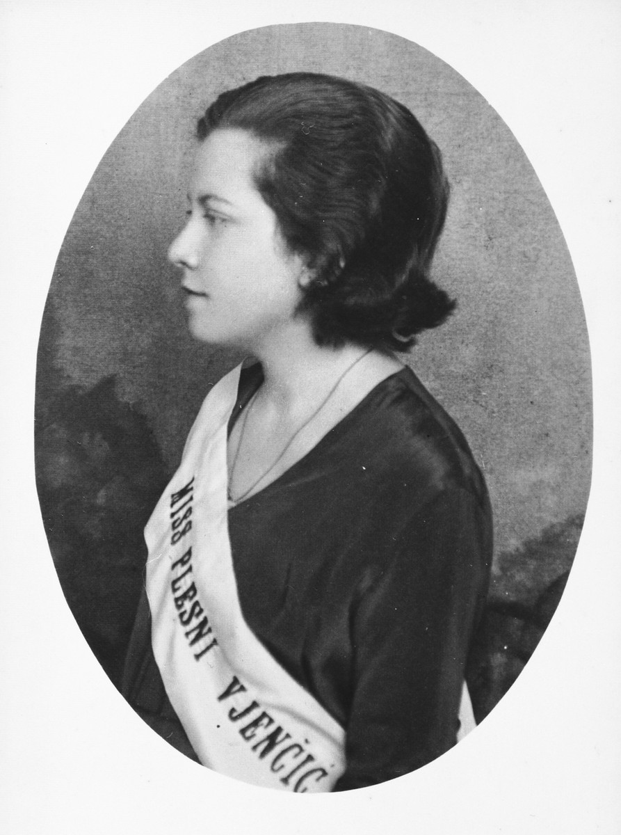 Portrait of a young Jewish woman who has just won the Miss Dance Cotillion contest.  

Pictured is Silva Deutsch wearing her sash.