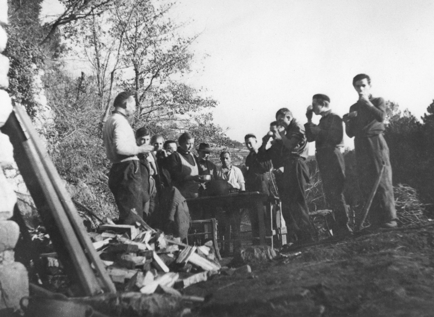 A group of Jewish teenagers stops for a snack on a farm near Vallon where they are hiding under the protection of MACE.