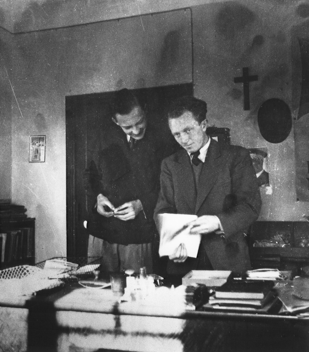 Joseph Fisera and a colleague look over some papers in his office in the Vence children's home.