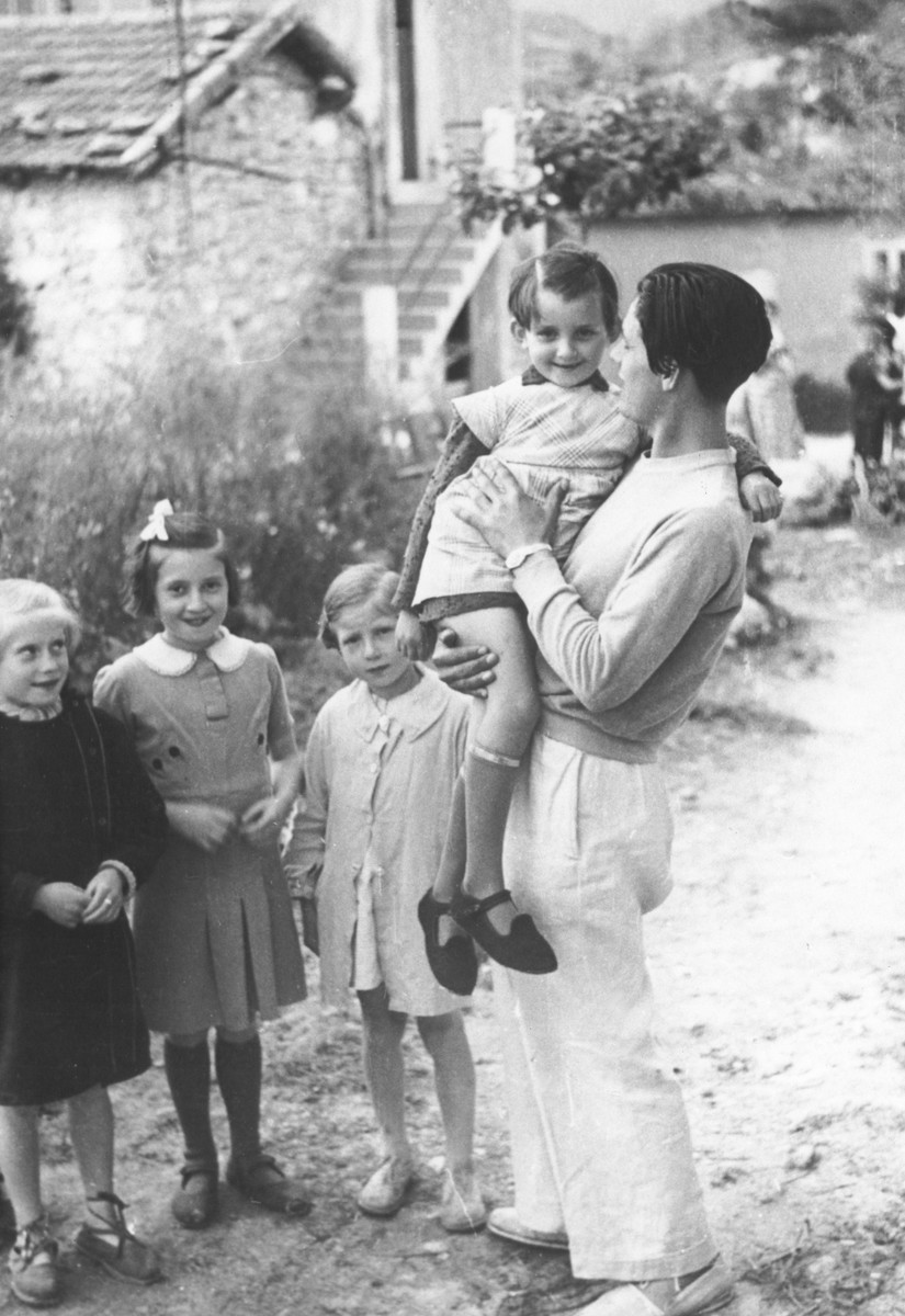 Karol Pajer, a former Slovak soldier and a teacher in the MACE (Maison d'Accueil Chretienne pour Enfants) children's home in Vence, holds one of the younger children.

After the dissolution of the home, Pajer joined the Maquis.