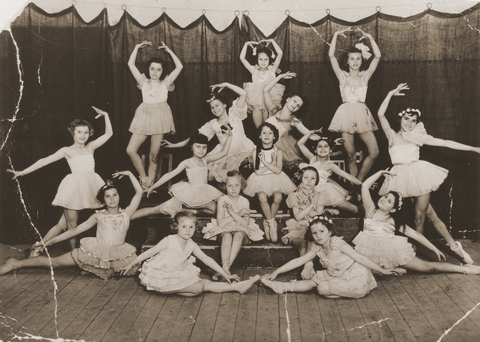 Group portrait of children dressed in tutus at a ballet class in Cluj.  

Eva Aron is pictured at the bottom left.