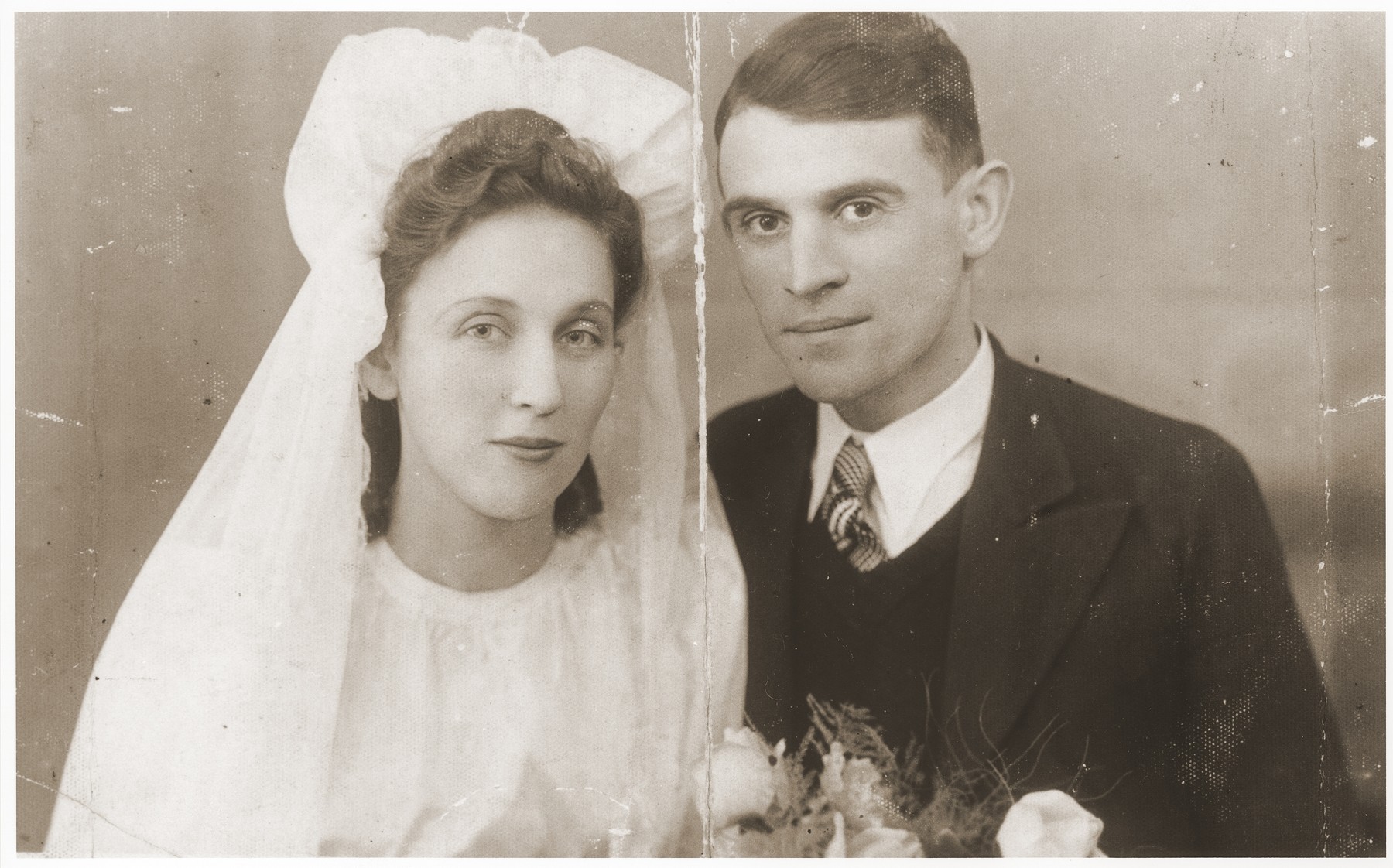 Wedding portrait of Gucia Brzeziner and Mendel-Ajzik Kleiner taken in the Lazy ghetto two years before they were killed at Auschwitz.