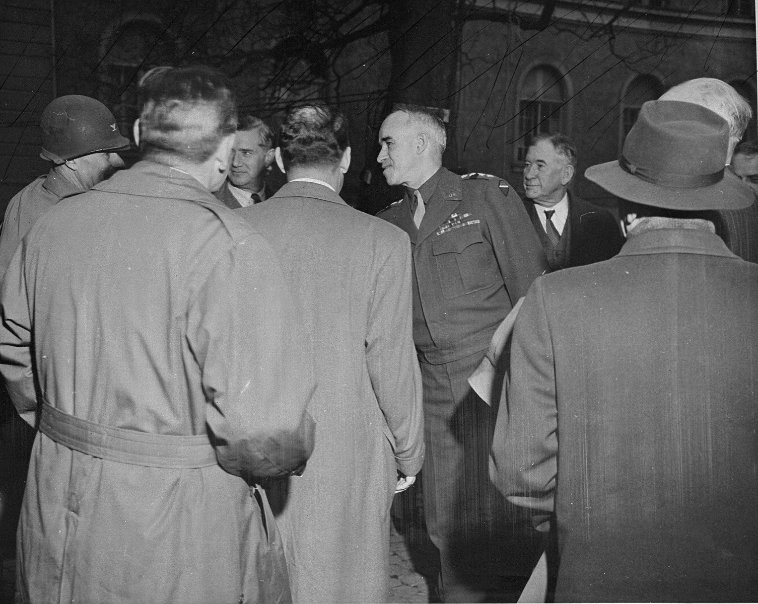General Omar Bradley greets a group of American congressmen at his headquarters in Wiesbaden.

The congressmen are making a tour of Europe to get first hand information on German atrocities.