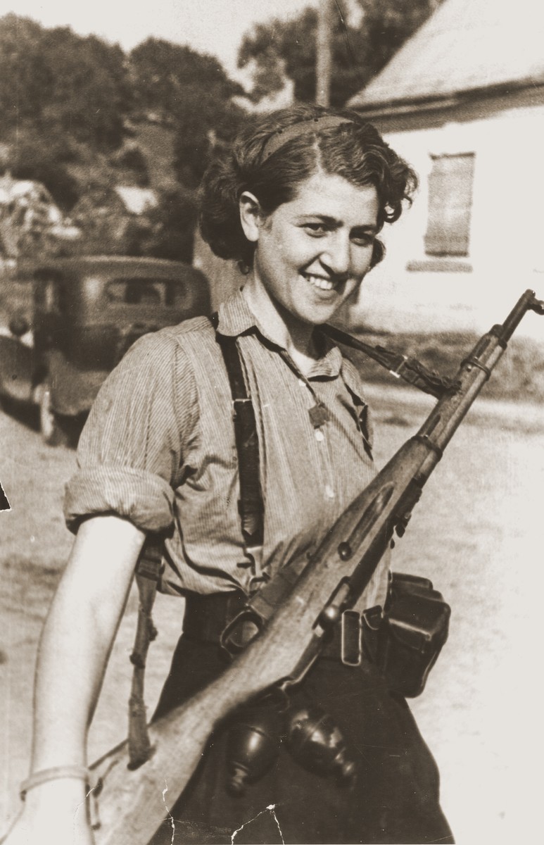 Portrait of female partisan, Sara Ginaite at the liberation of Vilna.  The photograph was taken by a Jewish, Soviet major who was surprised to see a female, Jewish partisan standing guard.