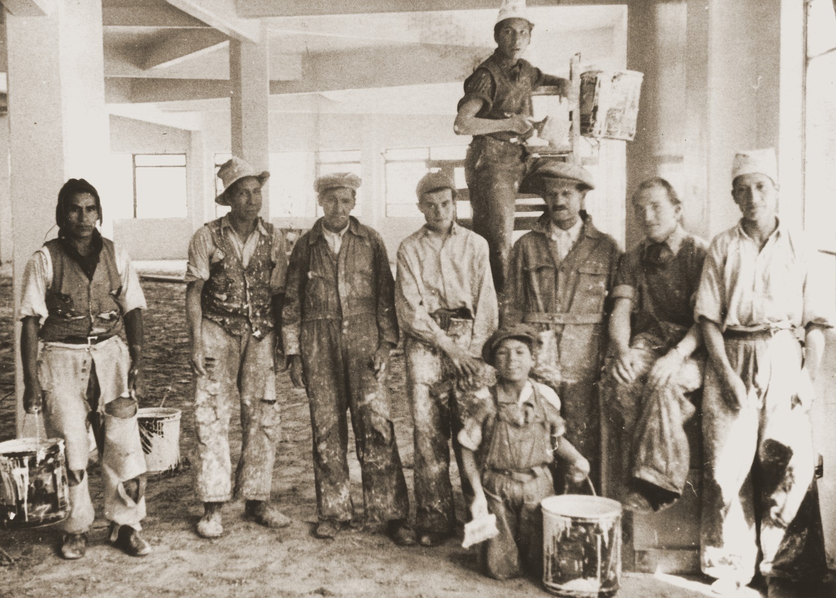 Austrian Jewish refugees pose with Bolivian workers at a construction site in La Paz.

Among those pictured are Nathan Wolfinger (third from the right) and Julius Wolfinger (fourth from the right).