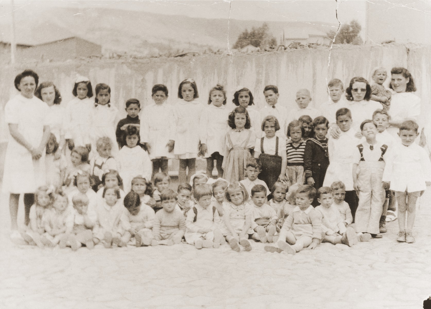 Kindergarten class at the Jewish Kinderheim in La Paz, Bolivia.  The Kinderheim was supported by funds from the JDC and SOPRO (Sociedad de protection immigrantes).

Leo Spitzer is pictured in the back row, (fourth from the right).