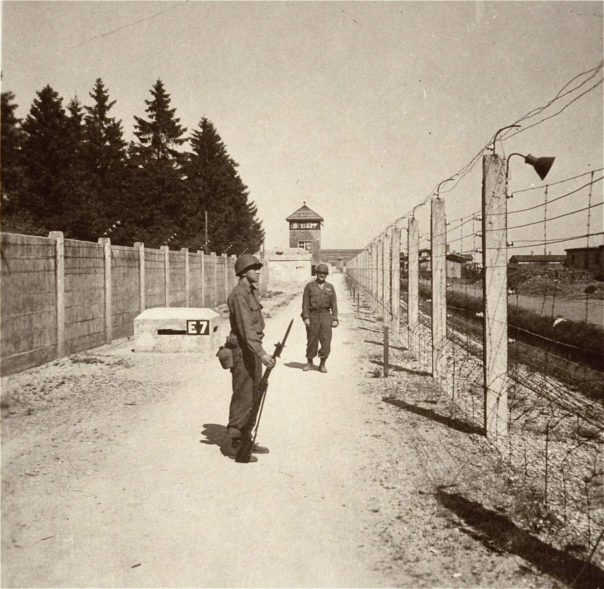 American liberators stand guard at Dachau.