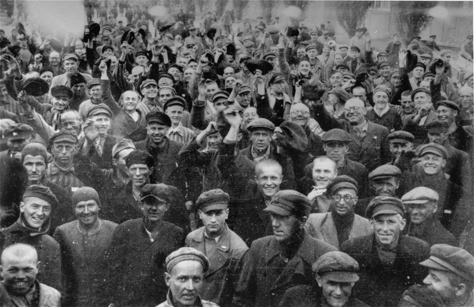 Survivors in Dachau cheer their liberators.