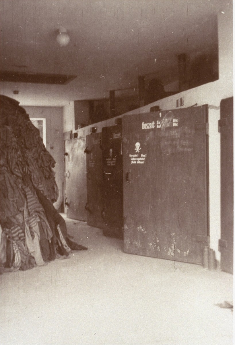 Prisoners' clothing is piled next to the door of a crematorium in the Dachau concentration camp.