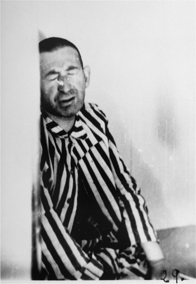 A prisoner in a special chamber responds to changing air pressure during high-altitude experiments.  For the benefit of the Luftwaffe, conditions simulating those found at 15,000 meters in altitude were created in an effort to determine if German pilots might survive at that height.