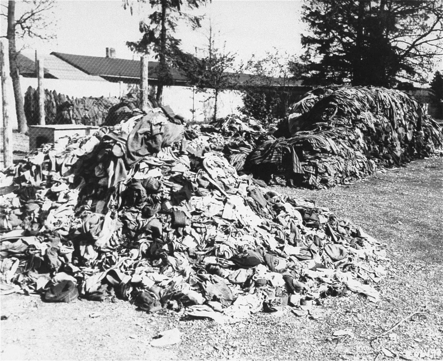 Prisoners' clothing is piled outside at the newly liberated Dachau concentration camp.