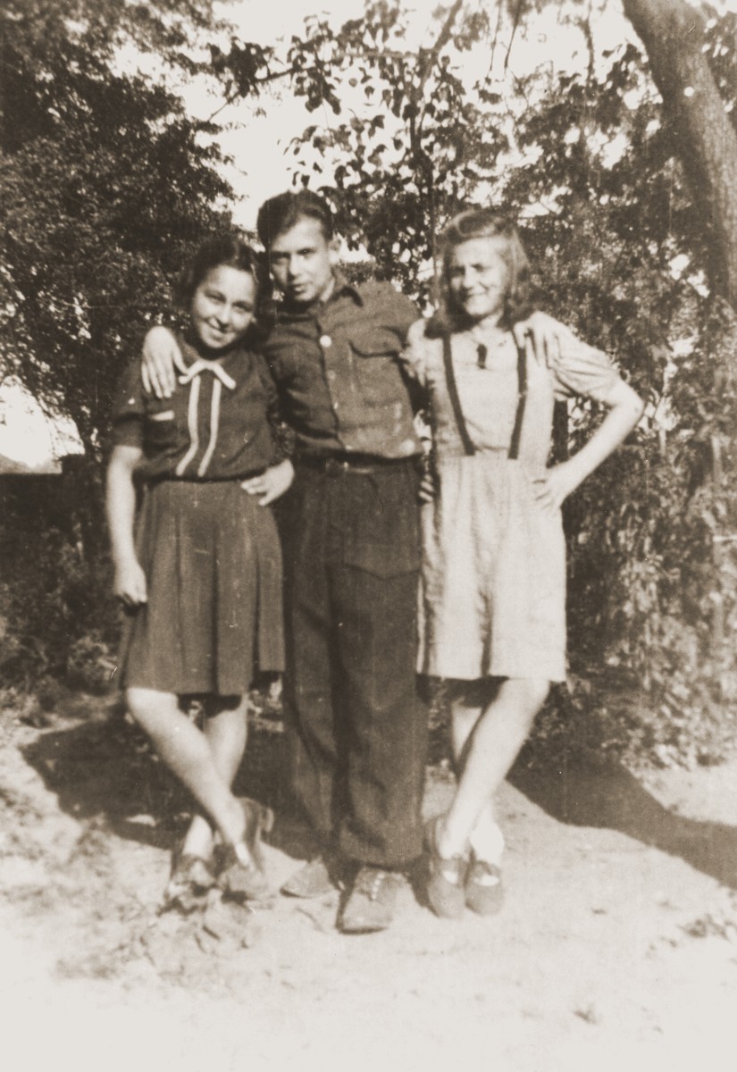 Three teenage orphans pose outside at the Jewish children's home in Gleiwitz, Poland.

Among those pictured is Salusia Goldblum (right).