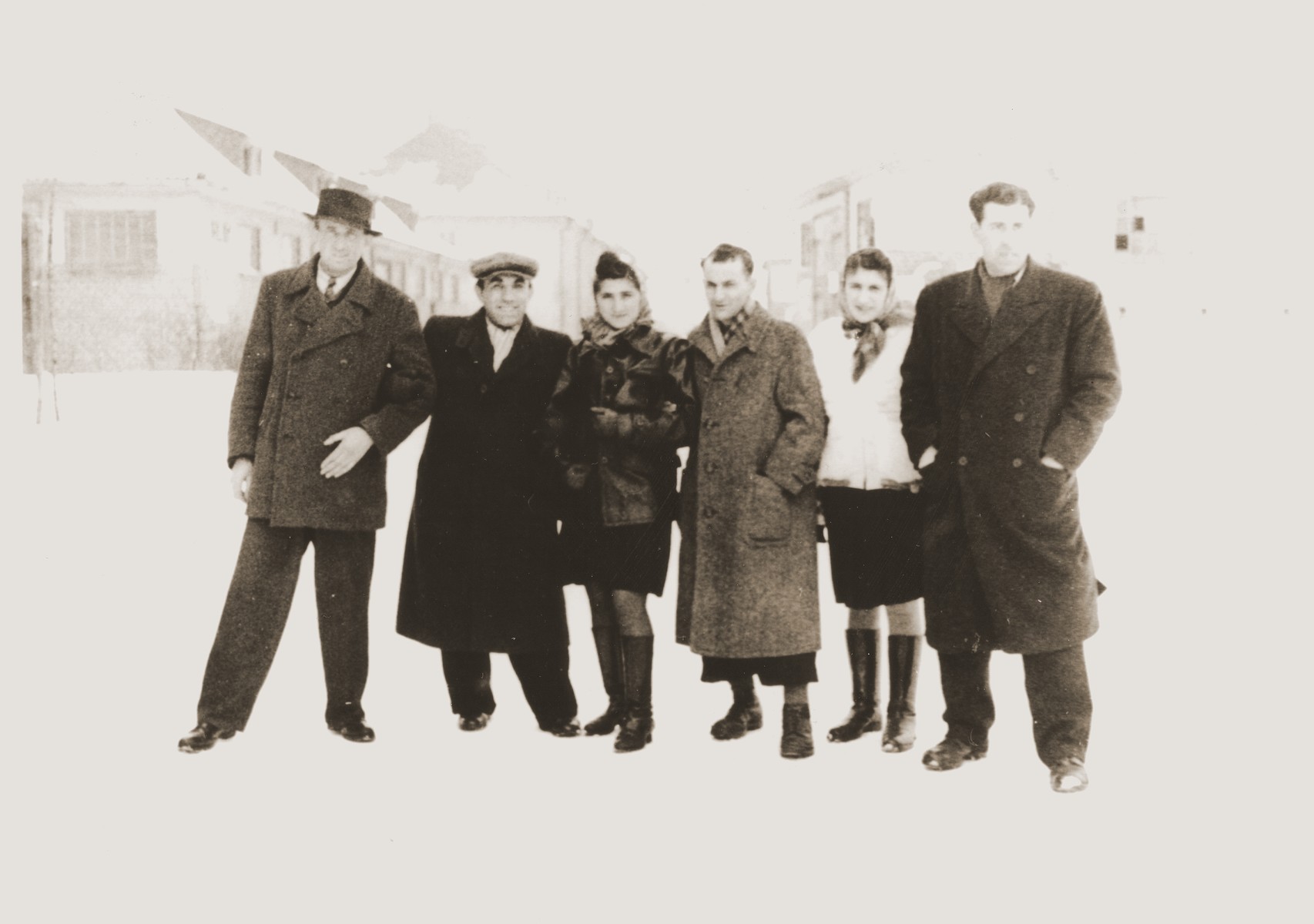 Group portrait of Jewish DPs standing in the snow in the Bergen-Belsen displaced persons camp.

Among those pictured are: Moishe Broda, David Marmor, Edek Goldblum and Manya (Goldblum) Marmor.