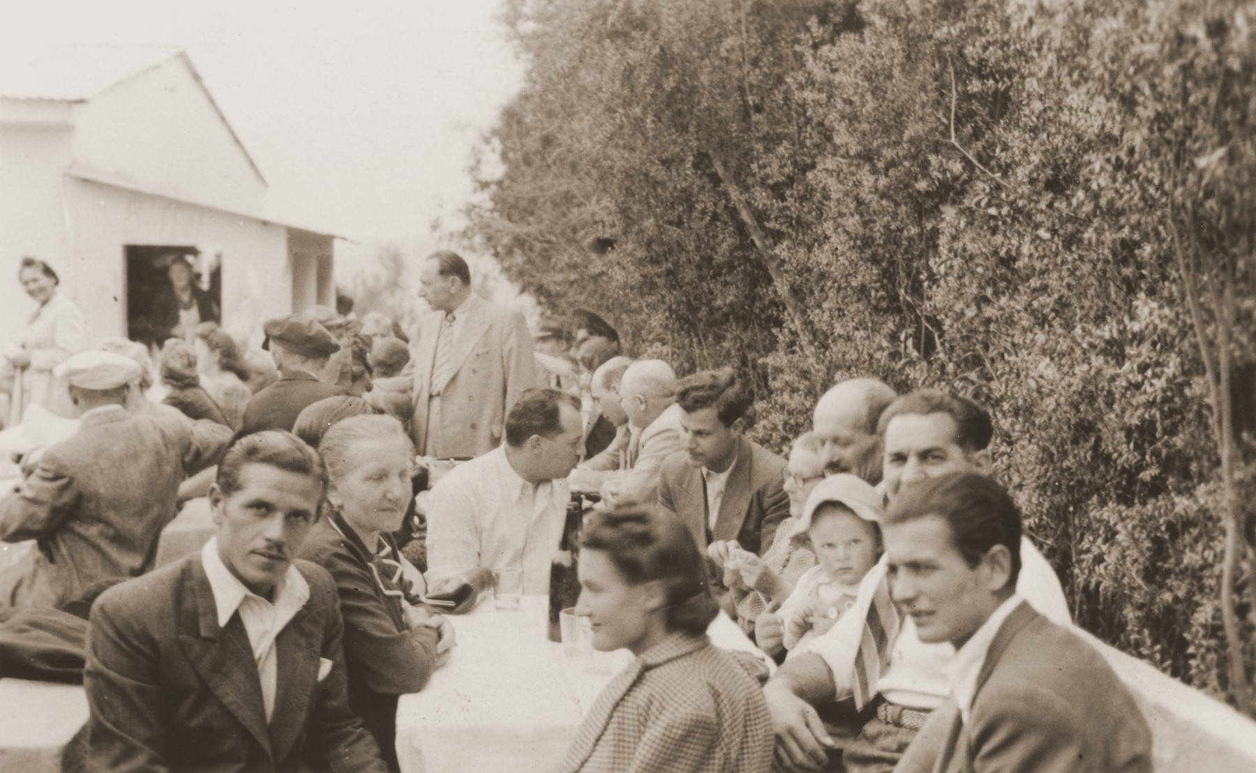 Austrian Jewish refugees in La Paz meet in a restaurant [Quinta Elma] to raise money for the victims of the Orazio shipwreck.

Among those pictured are Ferry Kohn (front, left); Lina Spitzer (behind Kohn); Rosie Spitzer (front, center); Julius Wolfinger (front, right); Eugen Spitzer (holding baby Leo); and Nathan Wolfinger (behind Leo).