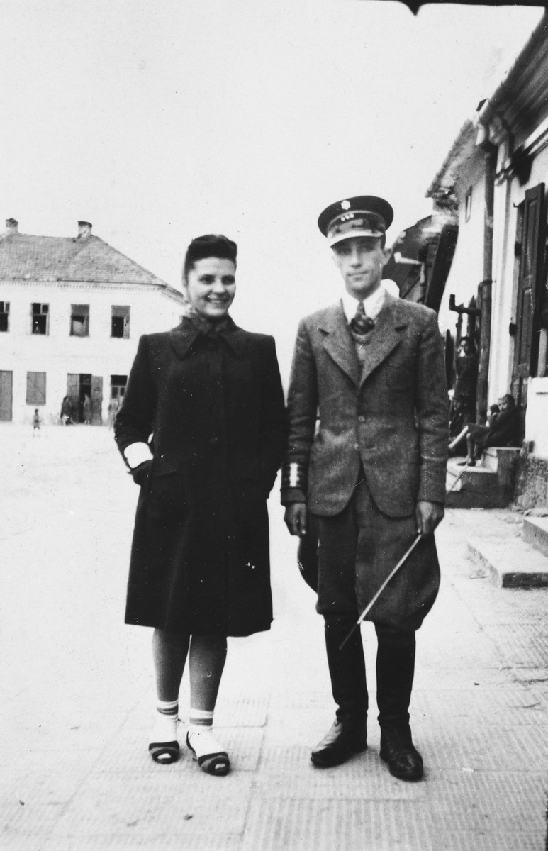 Bluma Kleinhandler poses with a ghetto policeman during a trip she took with members of the Jewish council in Chmielnik to Wislica.
