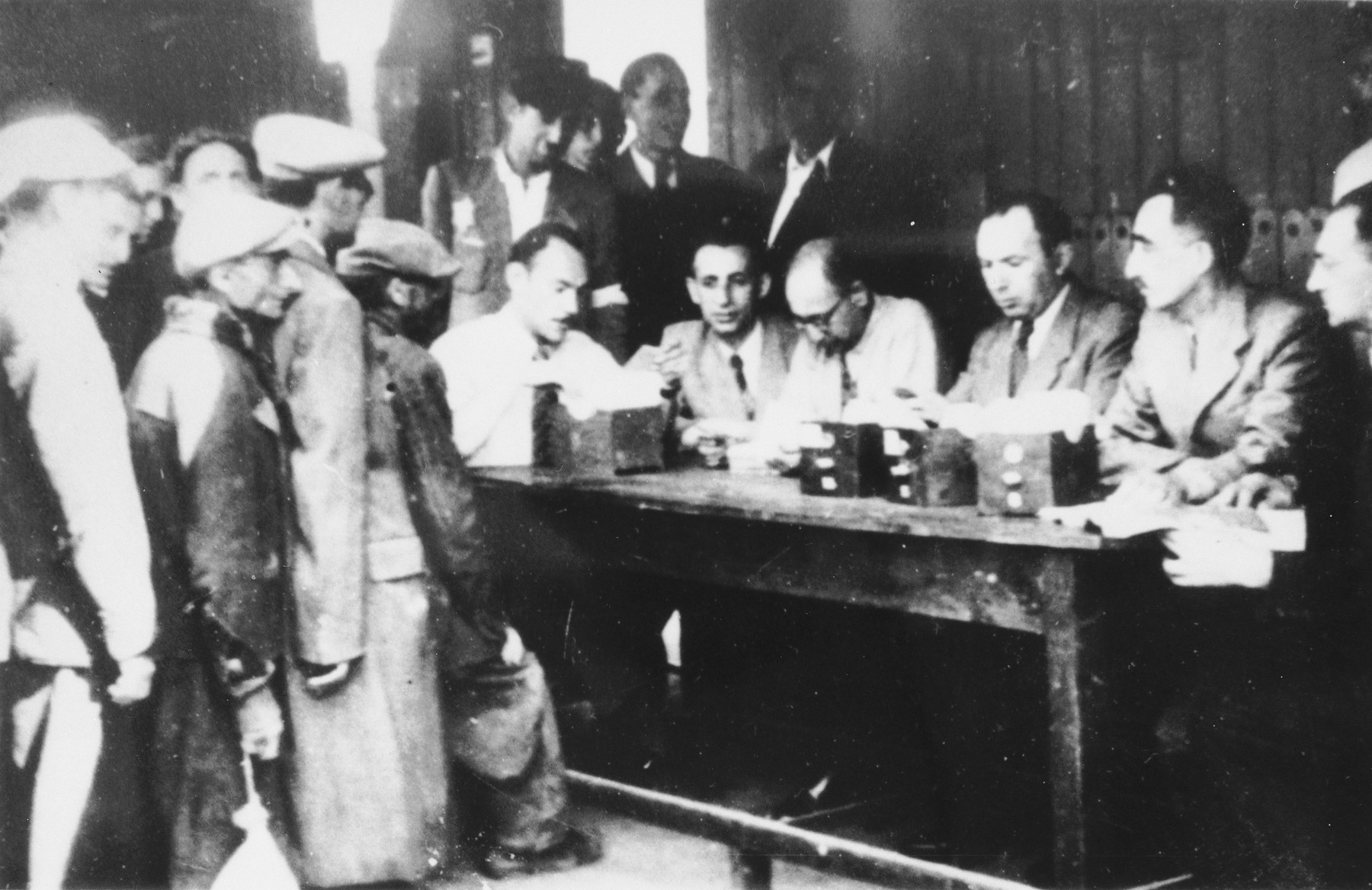 Jews wait in line to register in an unidentified ghetto.