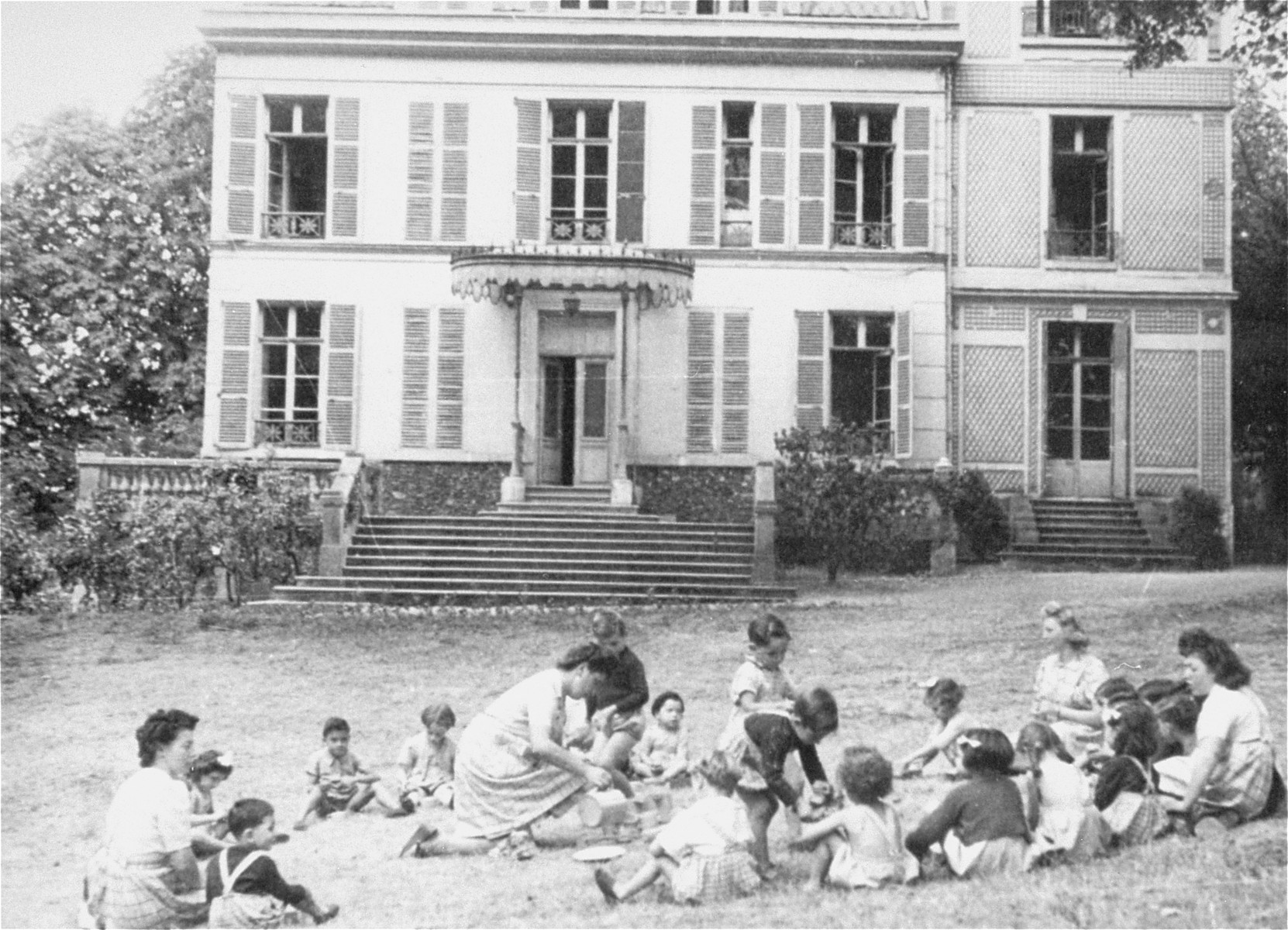 Children at play in the yard of Le Petite Monde children's home.