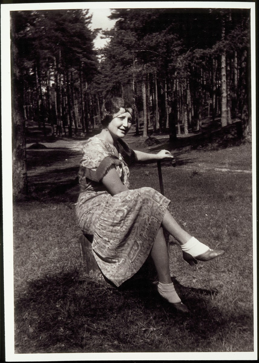 Margolia Saposnikow relaxes outdoors. 

Margolia Saposnikow was a cousin of Rosalind Foster She was murdered during the Holocaust.
