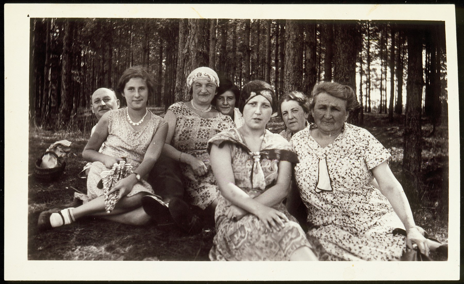 Family portrait taken in a wooded area not far from Vilna.

Front row, from right to left; Annie Virshubski Foster, Margolia Saposnikow, Sonia Virshubski Saposnikow and Nachama Saposnikow. Sitting in the back from right to left, Mrs Levenson, Golda (last name unknown) and Hillel Saposnikow.