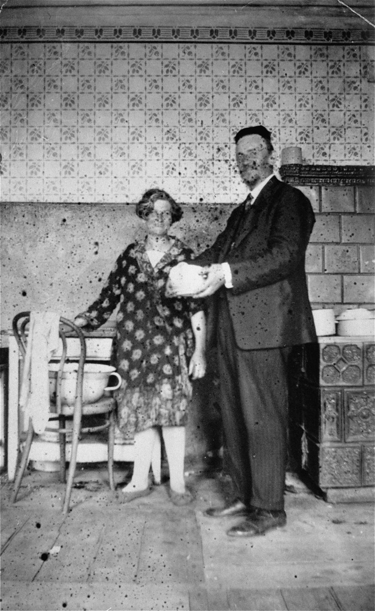 A Jewish couple poses in the kitchen of their home in Jaroslaw, Poland.

Pictured are Jacob and Miriam (Reich) Ringelheim, the donor's grandparents.