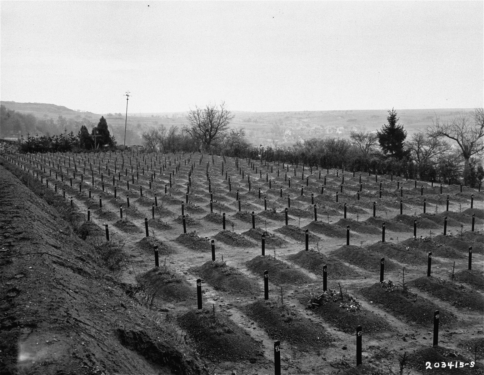 View of the cemetery at the Hadamar Institute, where victims of the Nazi euthanasia program were buried in mass graves.

The photograph was taken by an American military photographer soon after the liberation.