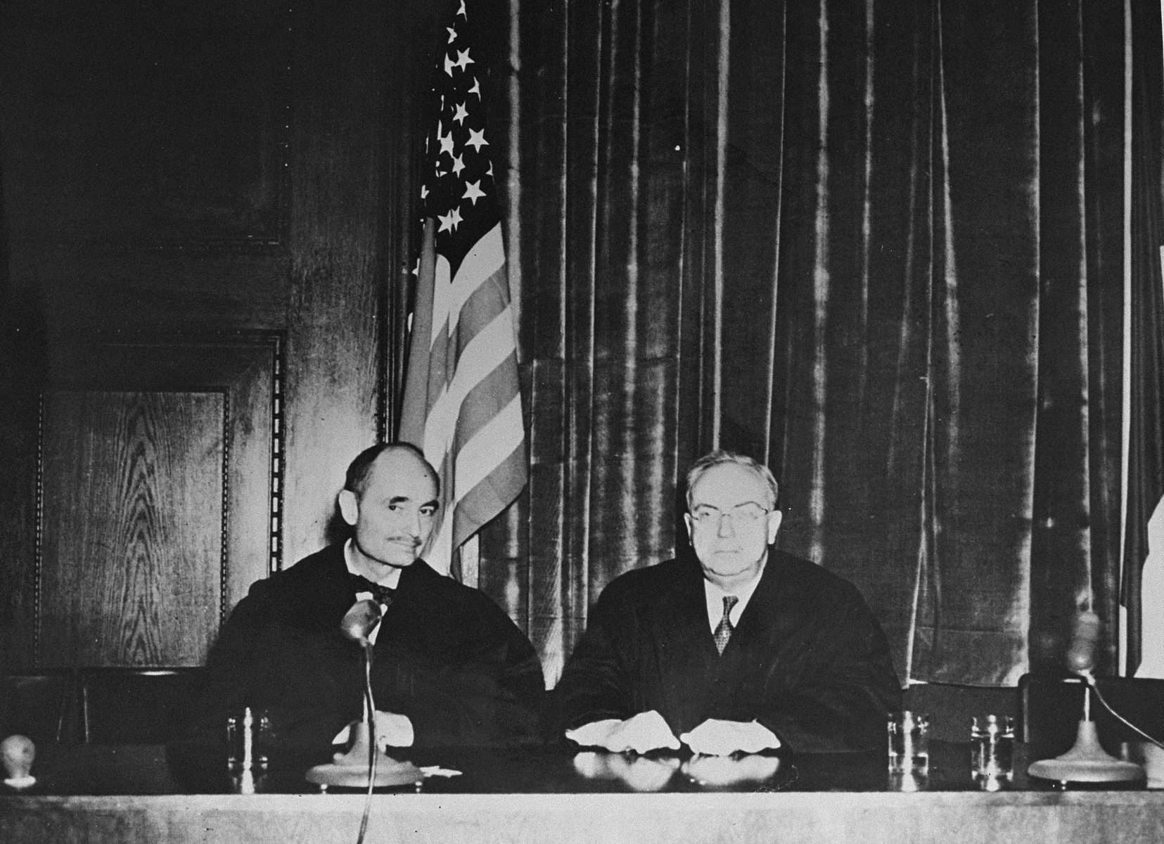 Portrait of the two American judges on the International Military Tribunal in Nuremberg.

Pictured at the left is Francis Biddle and, at the right, John J. Parker.