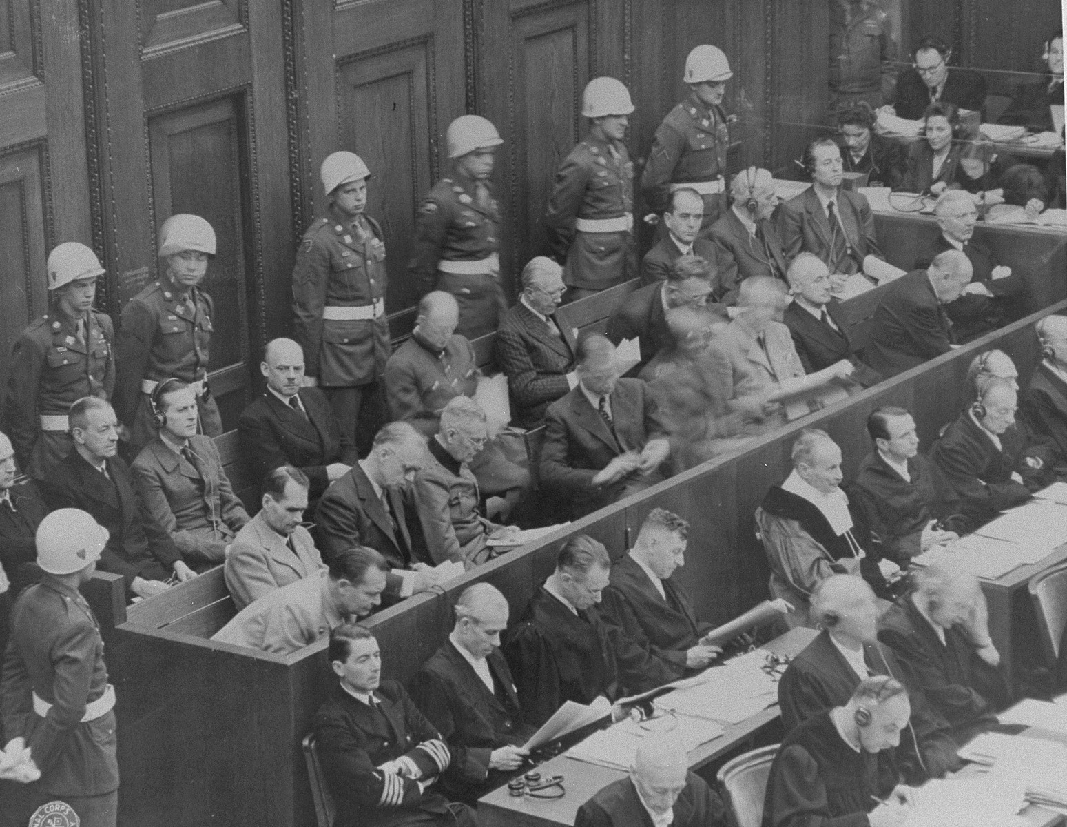 The defendants and their lawyers hear the reading of an indictment on the first day of the International Military Tribunal of war criminals at Nuremberg.