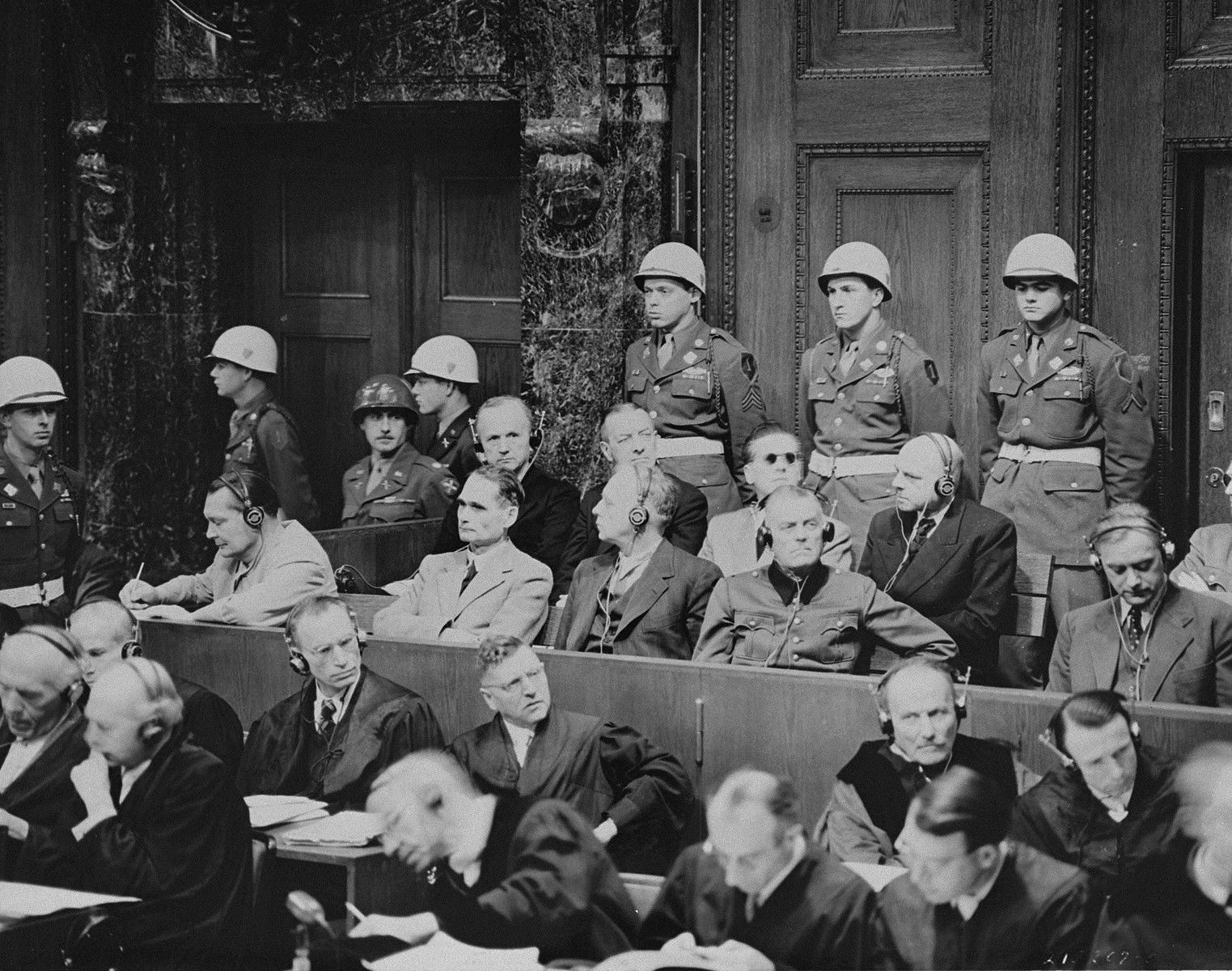 The defendants listen as the prosecution begins introducing documents at the International Military Tribunal for war criminals at Nuremberg.