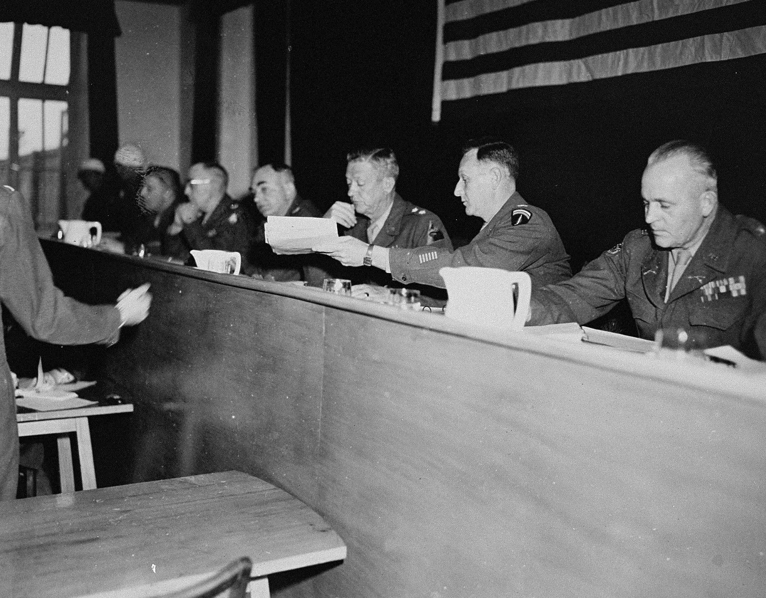 The American Military Tribunal hearing the trial of 61 former camp personnel and prisoners from Mauthausen.  Third from the right is the Tribunal's president, Major General Fay Brink Prickett.