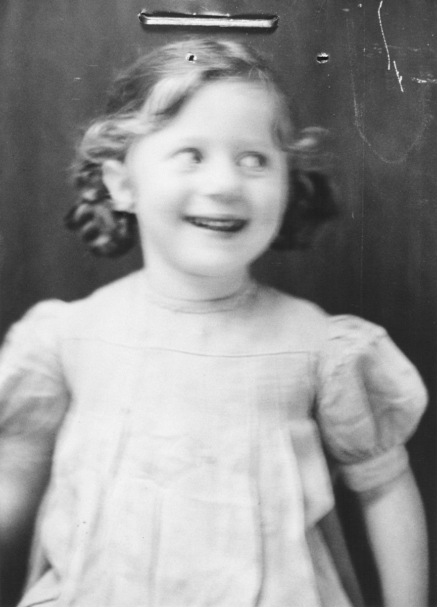 Portrait of a Jewish refugee child from Belgium taken by the Swiss police after she escaped with her family from occupied France into Switzerland in the fall of 1943.

Pictured is Frieda Wajsfeld.