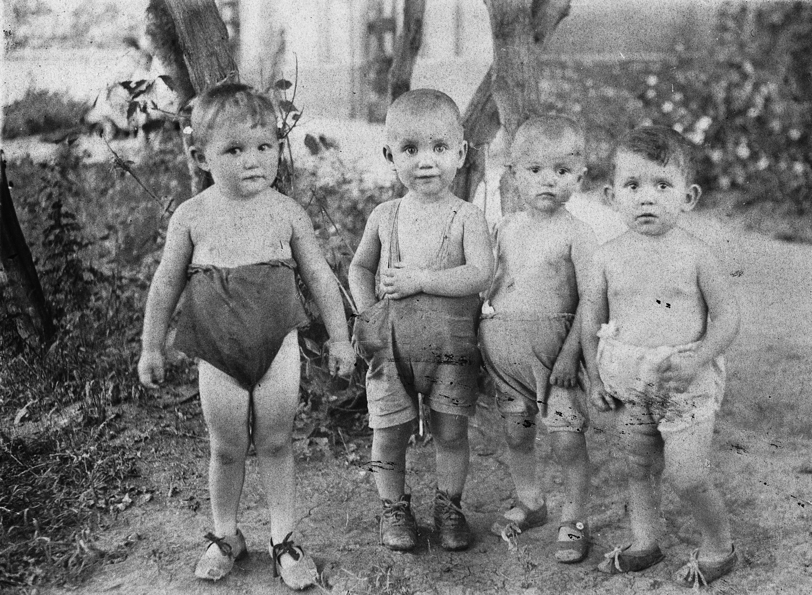 Portrait of four young children in a Soviet children's home in the Ukraine.

Pictured on the far left is Ludmilla Iastuhina.
