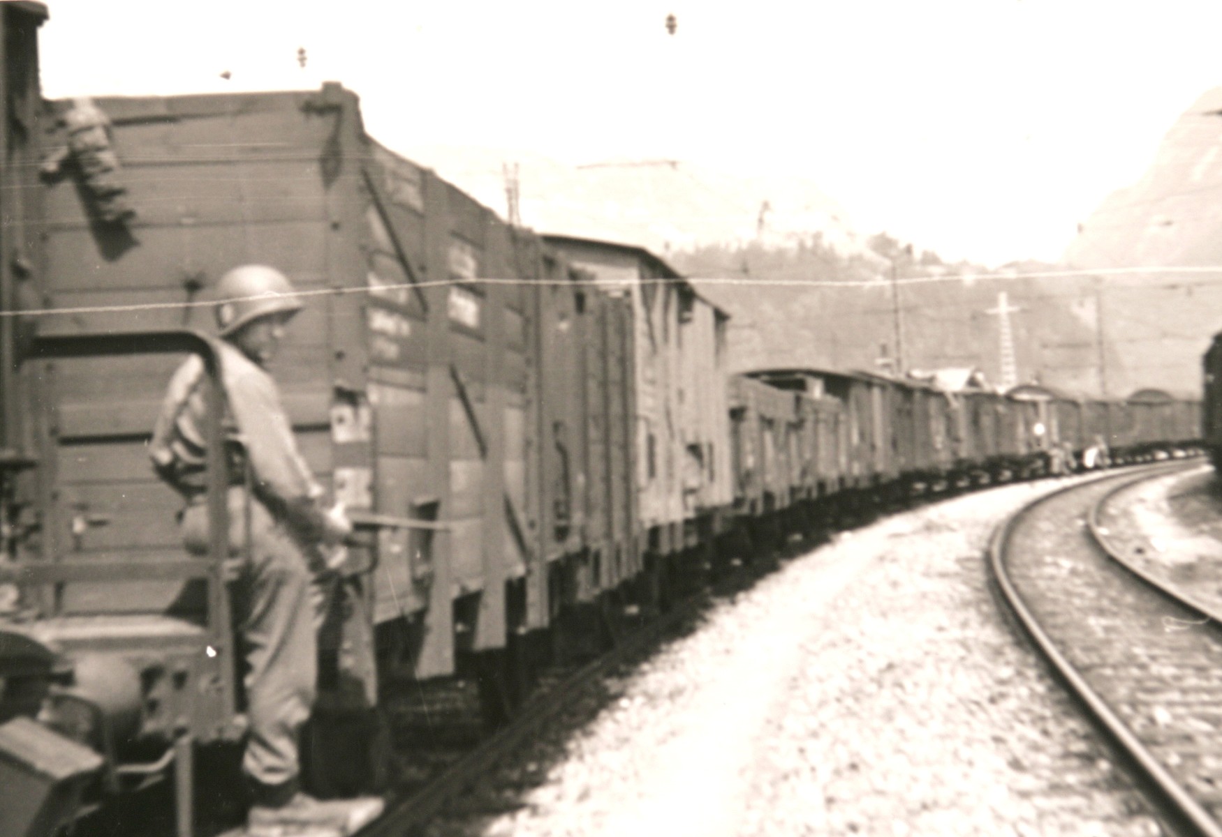 An American soldier guards the Hungarian Gold Train in Werfen, Austria, soon after the American occupation authorities took custody of the train.

The original caption reads: "The Hungarian train of loot; view of freight cars."