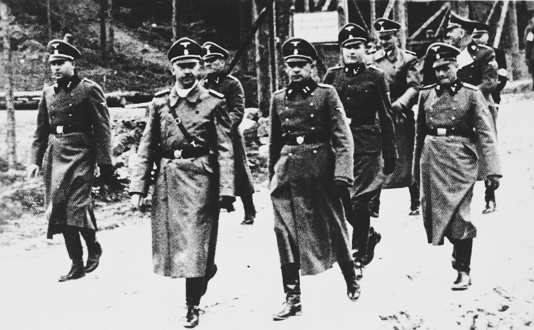 Heinrich Himmler goes on an inspection tour of the Flossenbuerg concentration camp.

Heinrich Himmler is pictured second from the left.  To his right the camp commandant Karl Künstler, to his far right the adjutant Ludwig Baumgartner. In the back: Karl Wolff and Oswald Pohl (from left).